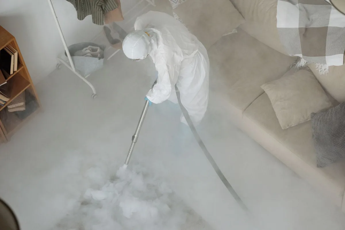 Biohazard cleanup technician in protective equipment, Holyoke, MA